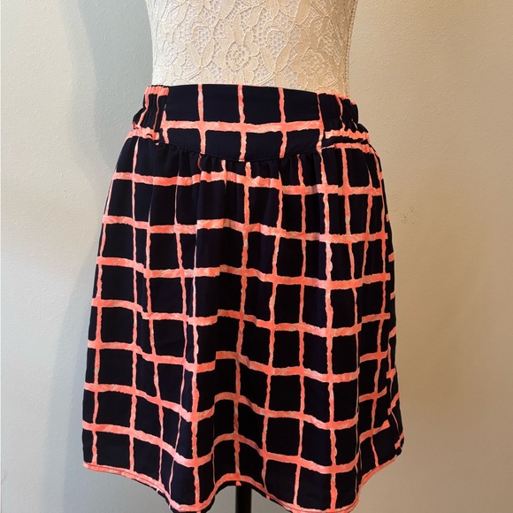 Francesca’s Dresses & Skirts - Mi a mi Francesca’s Navy and Coral Patterned Skirt